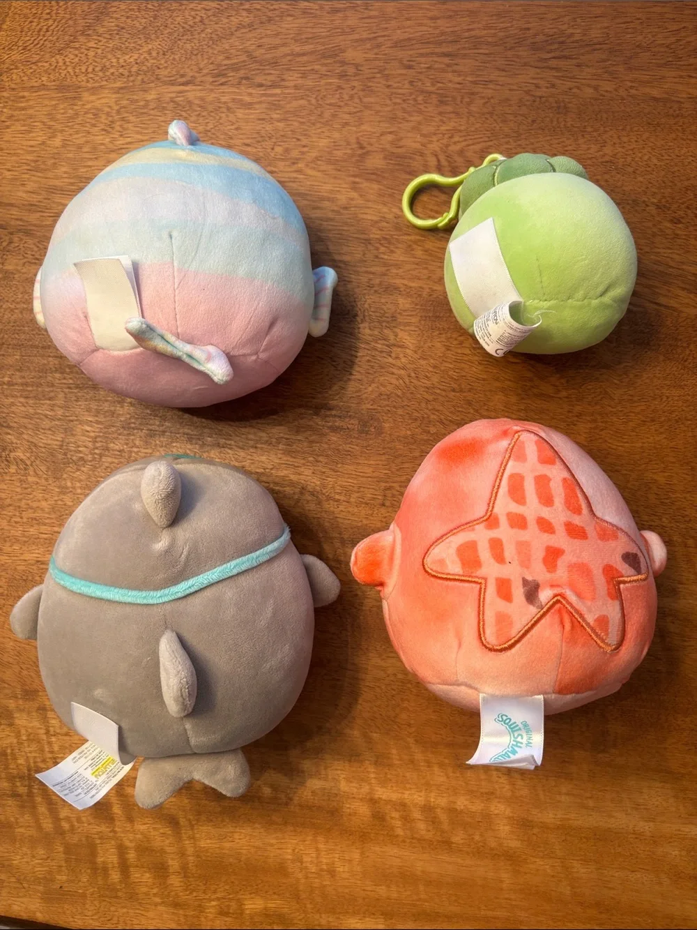 Squishmallows pastel rainbow, green, gray, and coral plush bundle
